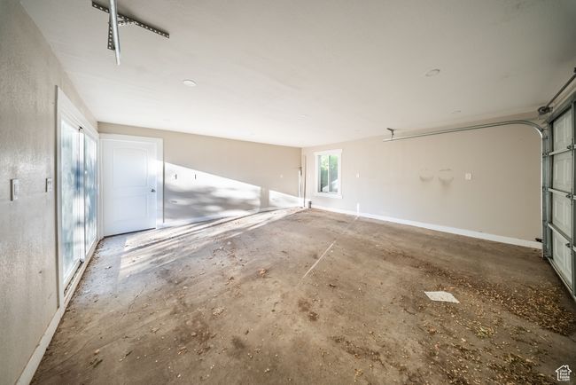Garage with baseboards | Image 4