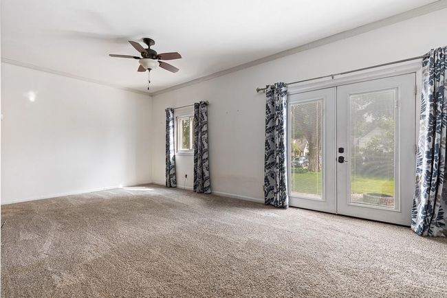 Living room on the main level with direct patio access | Image 20