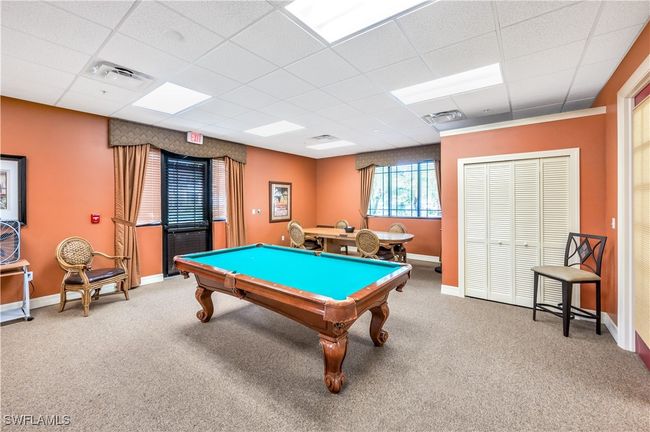 Community Game room with pool table, a drop ceiling, and carpet flooring | Image 26