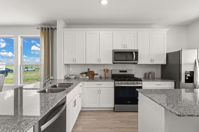 Photo of Pulte model home with same floor plan, not of actual home listed. | Image 4