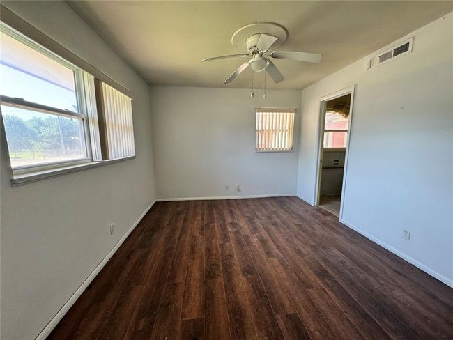 Unfurnished room featuring ceiling fan and wood-type flooring | Image 33