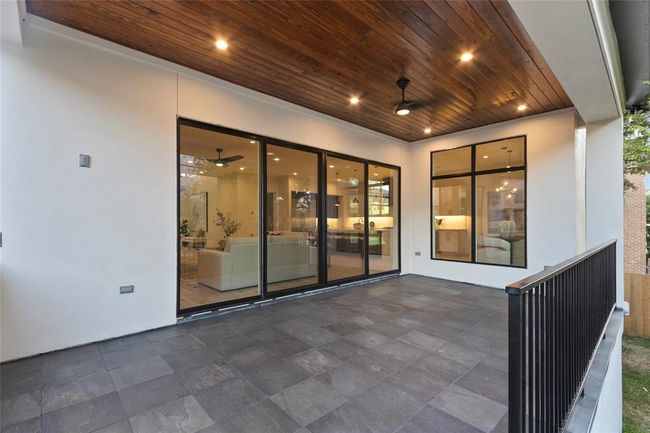 Spacious patio with upgraded wood ceiling pre wired for surround speakers with gas, water and electric connections | Image 32