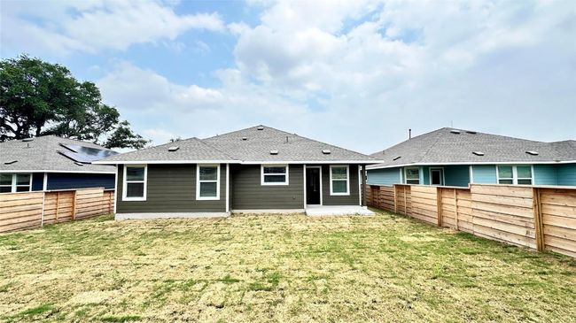 Rear view of house featuring a yard and a fenced backyard | Image 23