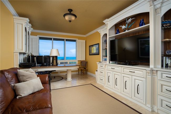 Office or dining room with ocean views and electric hurricane blinds. This room has different furniture in it now which conveys. | Image 9