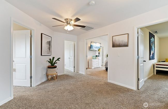 Bright and open upstairs landing ties all five bedrooms together—ideal for a second lounge, game room, or flexible multi-use space. | Image 13