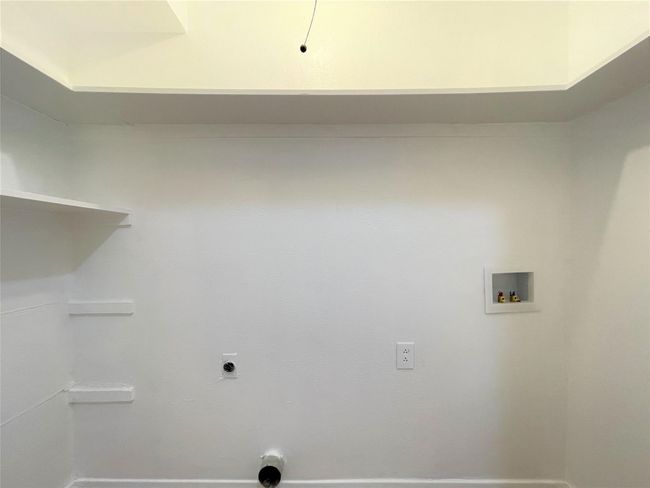 Laundry area featuring hookup for a washing machine and electric dryer hookup | Image 18