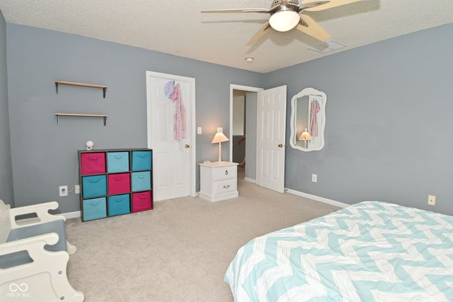 carpeted bedroom with baseboards and ceiling fan | Image 32