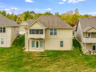 Back of house with a patio, central AC, and a lawn | Image 2