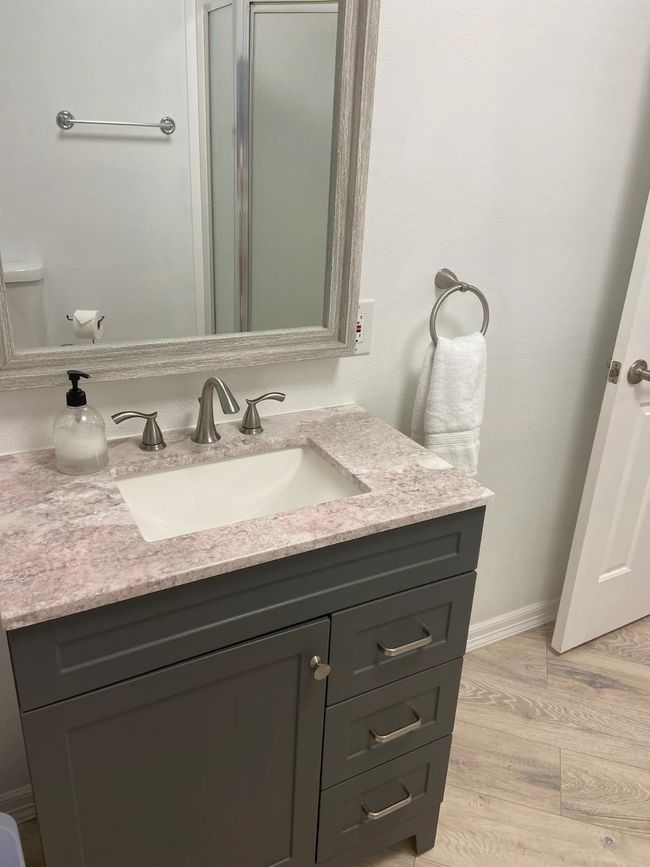 Bathroom featuring hardwood / wood-style floors, vanity, and toilet | Image 19