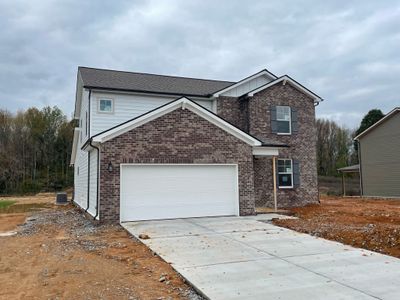 Brick and Hardieboard exterior with a two car garage (actual home 11-14) | Image 3