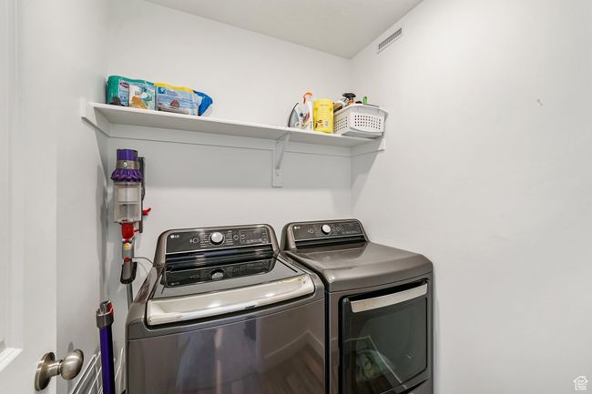 Laundry room with independent washer and dryer | Image 24