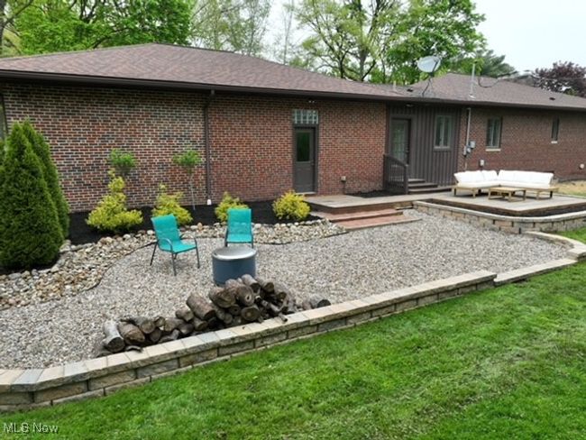 Back of property featuring a patio, brick siding, and a yard | Image 31