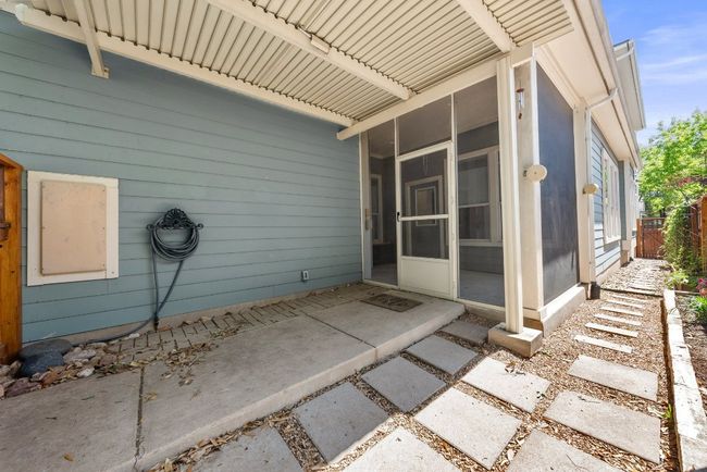 View of patio / terrace featuring fence and a sunroom | Image 35