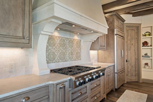 Gas cook top with custom stone vent hood | Image 18