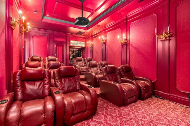 Carpeted cinema room featuring crown molding and coffered ceiling | Image 27