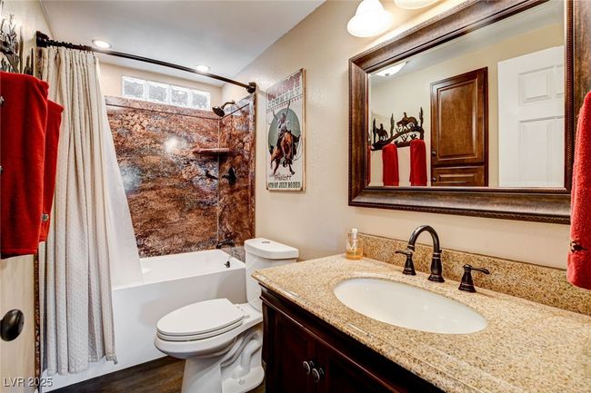 Full bath with shower / bath combo, vanity, and wood finished floors | Image 14
