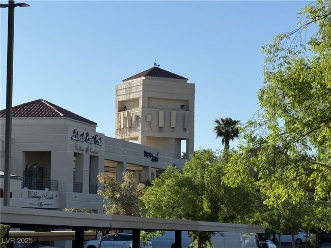 View of building exterior with covered parking | Image 24