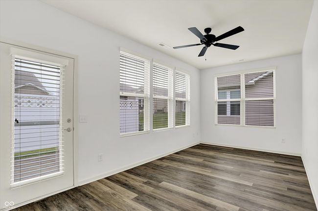 unfurnished room featuring wood finished floors and a ceiling fan | Image 8