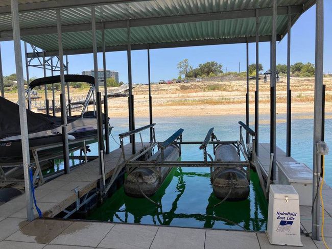 Dock with boat lift and a water view | Image 9