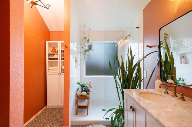 Bathroom featuring vanity, a tile shower, and a textured wall | Image 15
