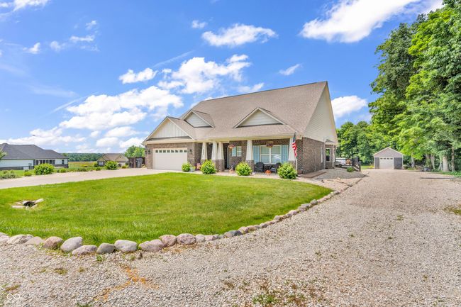 view of front of home with driveway leading to 16x24 detached garage | Image 45