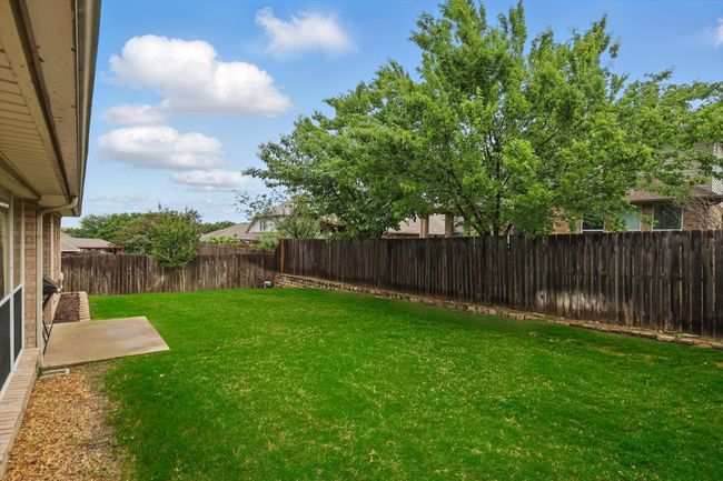 View of yard with a fenced backyard | Image 39