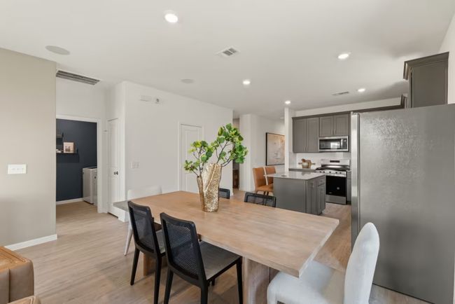 Photo of Pulte model home with same floor plan, not of actual home listed. | Image 4