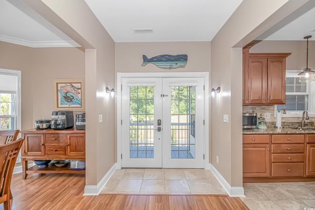 Doorway to outside with plenty of natural light and french doors | Image 7