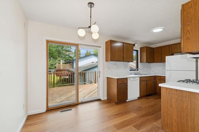 Update light fixtures and flooring in the kitchen | Image 6