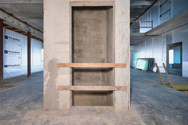 Staircase with unfinished concrete flooring | Image 30