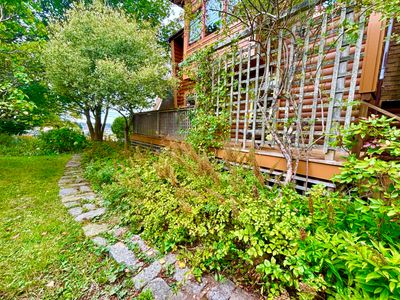 Granite path leads to private deck off dining and beyond to back yard | Image 3