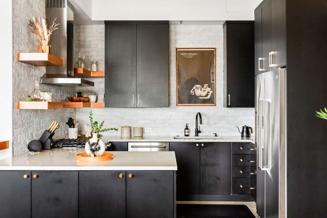 Kitchen featuring open shelves, extractor fan, light stone countertops, stainless steel appliances, and a peninsula | Image 15