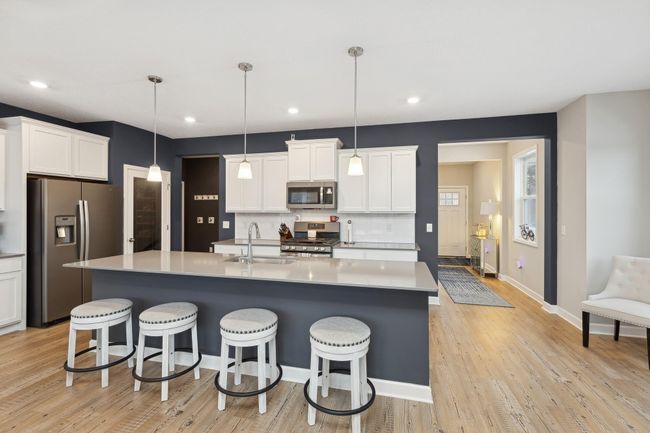 View to front entry and powder bath on the right, mudroom and garage access to the left. | Image 9