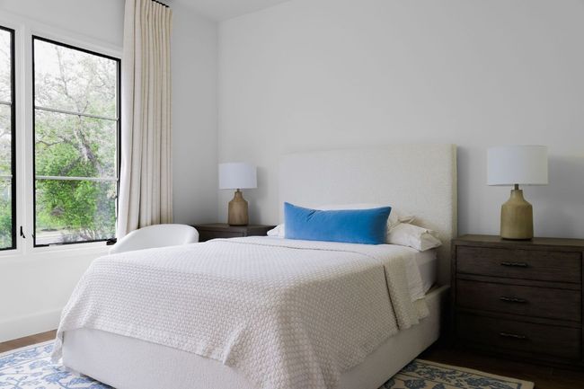 Bedroom featuring multiple windows and wood finished floors | Image 24