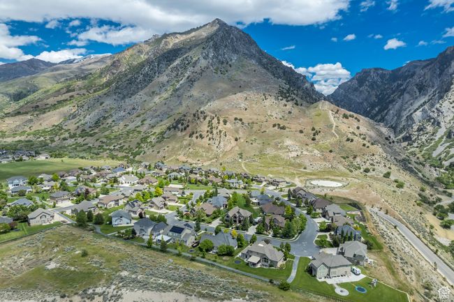 Aerial view of property's location featuring a mountainous background and nearby suburban area | Image 50