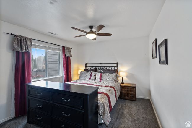 Bedroom featuring carpet and ceiling fan | Image 12