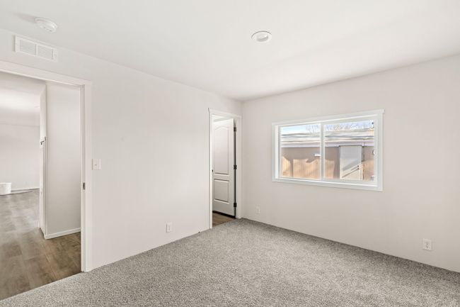 primary bedroom facing closet | Image 7