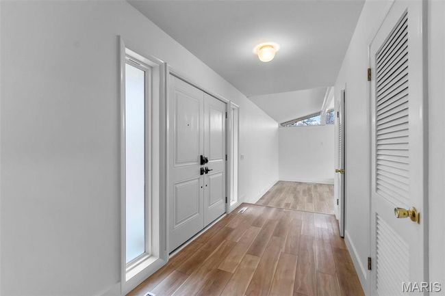 Corridor with light hardwood/wood-style flooring | Image 11