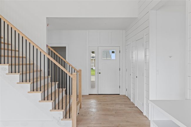 Entrance foyer featuring wood finished floors and stairs | Image 12