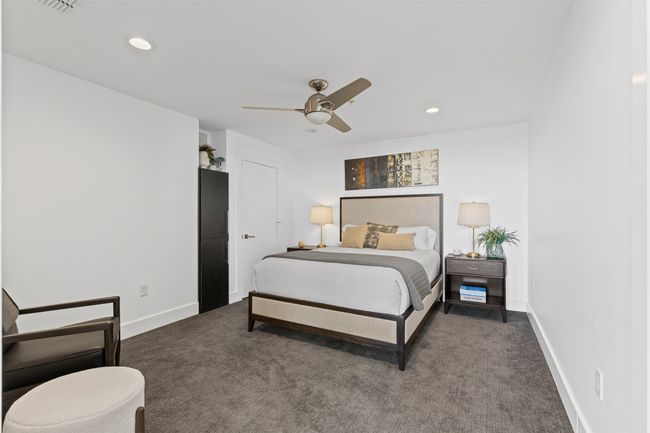 Bedroom with recessed lighting, dark colored carpet, visible vents, baseboards, and ceiling fan | Image 13