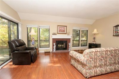 Spacious living room with sliding door to the rear patio. | Image 2