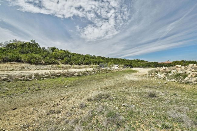 This vantage point shows some of your 3+ acres and the places you can store grown-up toys, raise chickens, or let your imagination run wild! All of this 3+ acres is very usable and accessible. | Image 38