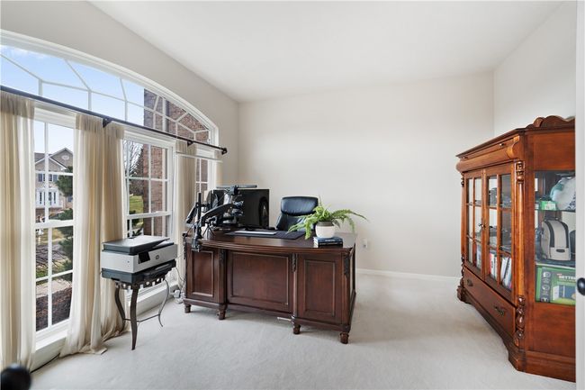 The den features beautiful large windows and french doors for the ultimate executive experience. | Image 6
