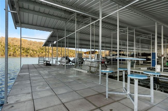 Dock area featuring a water view | Image 67