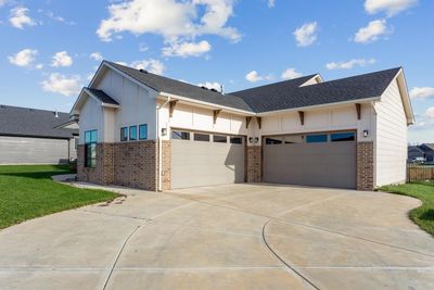 View of front facade featuring a garage and a front lawn | Image 2