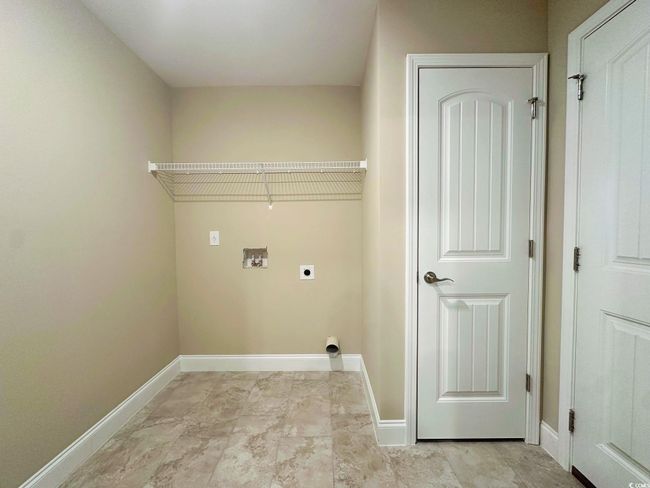 Spare room featuring vaulted ceiling, baseboards, a ceiling fan, and carpet | Image 16
