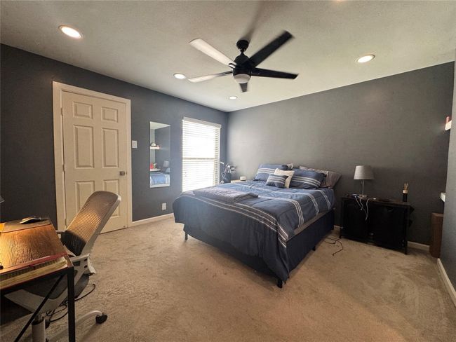 Bedroom with light colored carpet, recessed lighting, baseboards, and a ceiling fan | Image 10