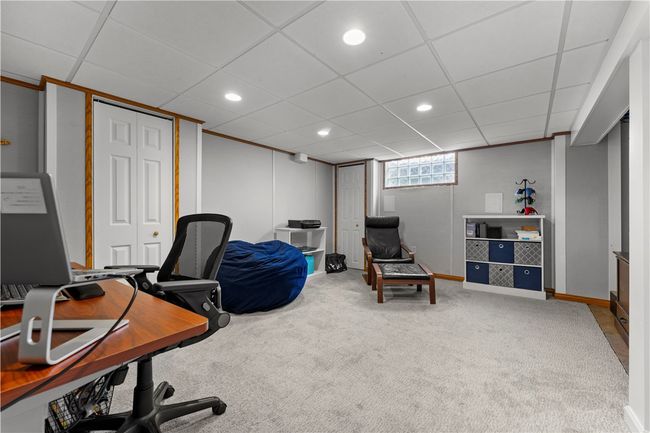 The lower level game room has been sound proofed making it perfect for an office or a TV room. | Image 16
