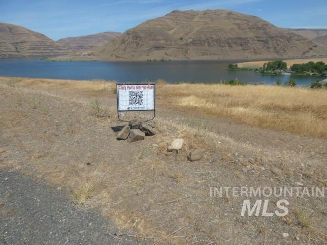 Water view with a mountainous background | Image 8