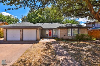 Ranch-style house featuring a garage | Image 2